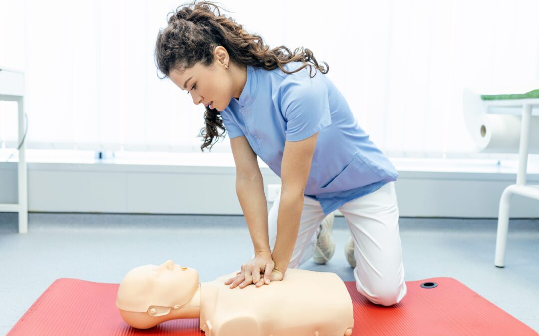 Lady Practicing CPR on a Dummy