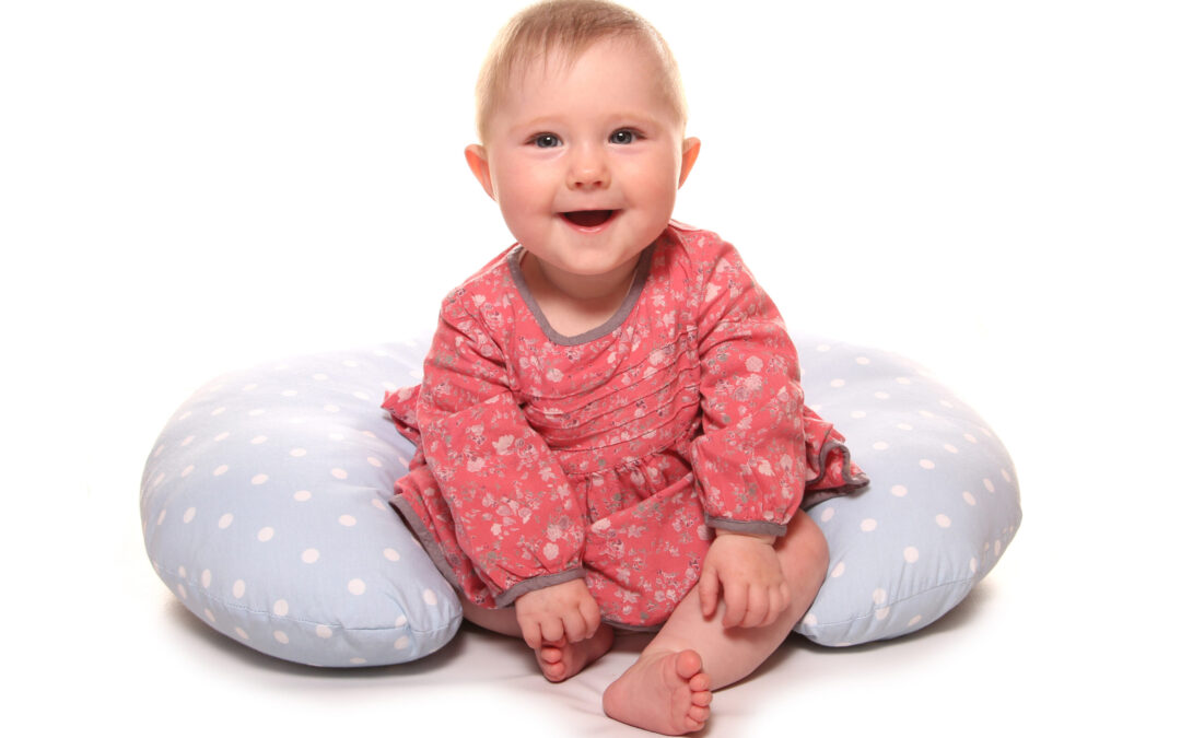 Baby,Girl,Learning,To,Sit,Using,A,Pillow,Cutout