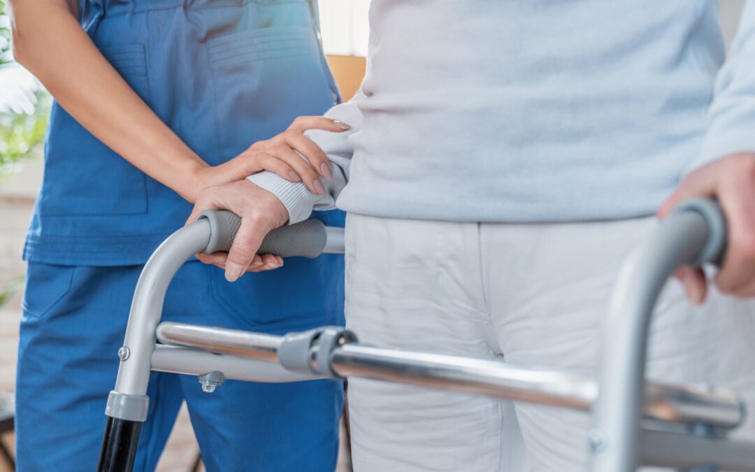 Cropped,Image,Of,Nurse,Helping,Senior,Woman,To,Walk,With