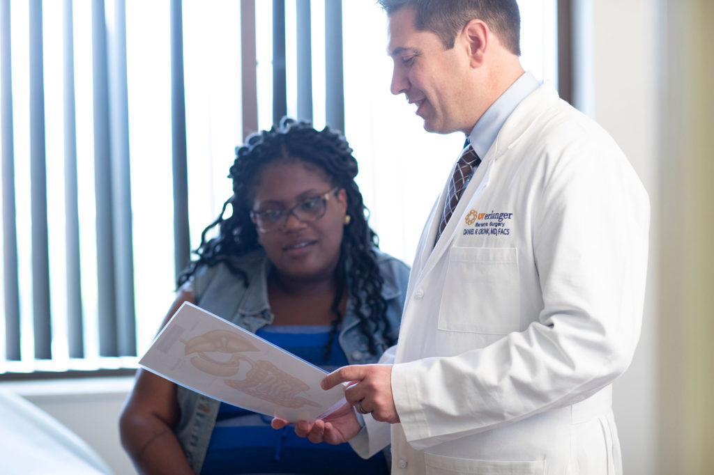 Dr. Cronk with patient in bariatric surgery consultation