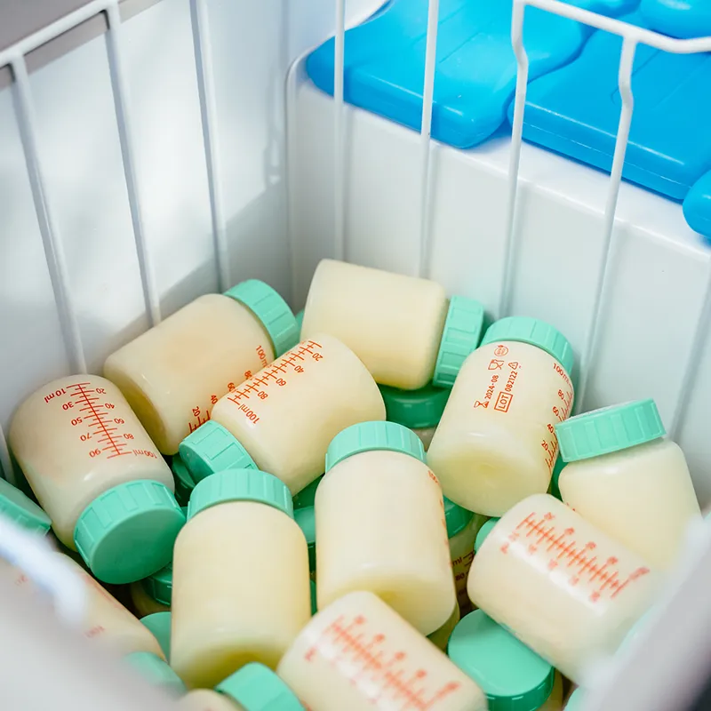 bottles of donated breast milk for milk bank